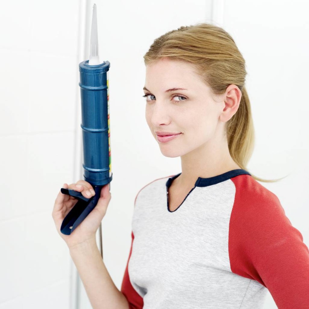 lady holding construction gun