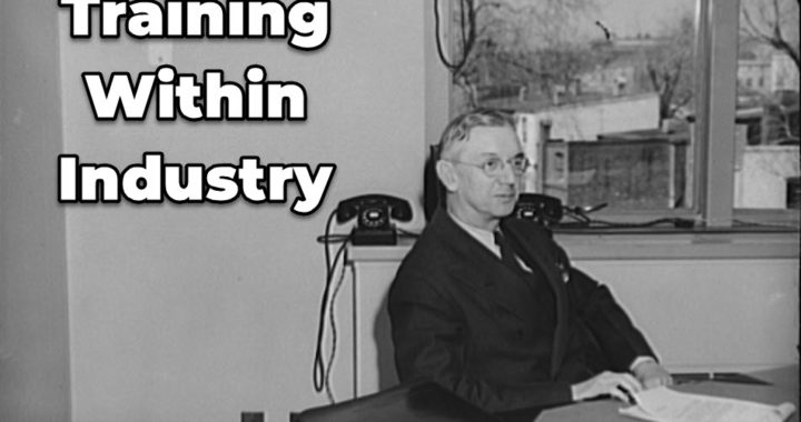 executive sitting at desk in the 1940s
