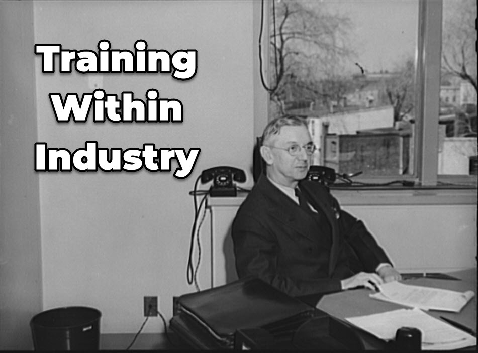executive sitting at desk in the 1940s