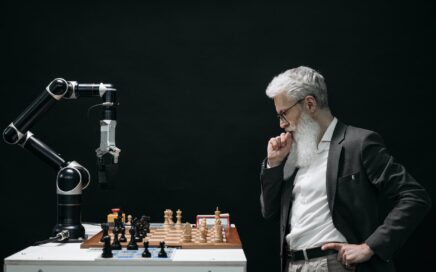 elderly man thinking while looking at a chessboard