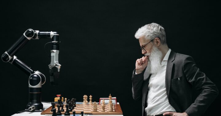 elderly man thinking while looking at a chessboard